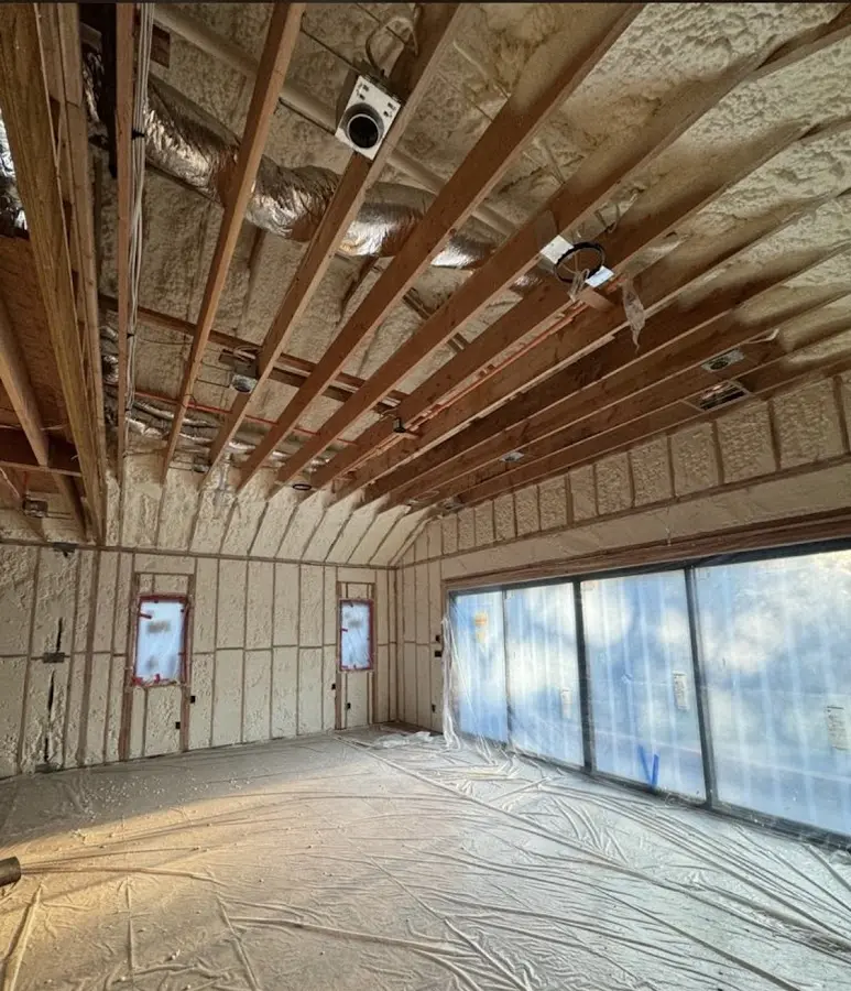 Interior walls and ceiling insulated with spray foam during new construction in Troutdale